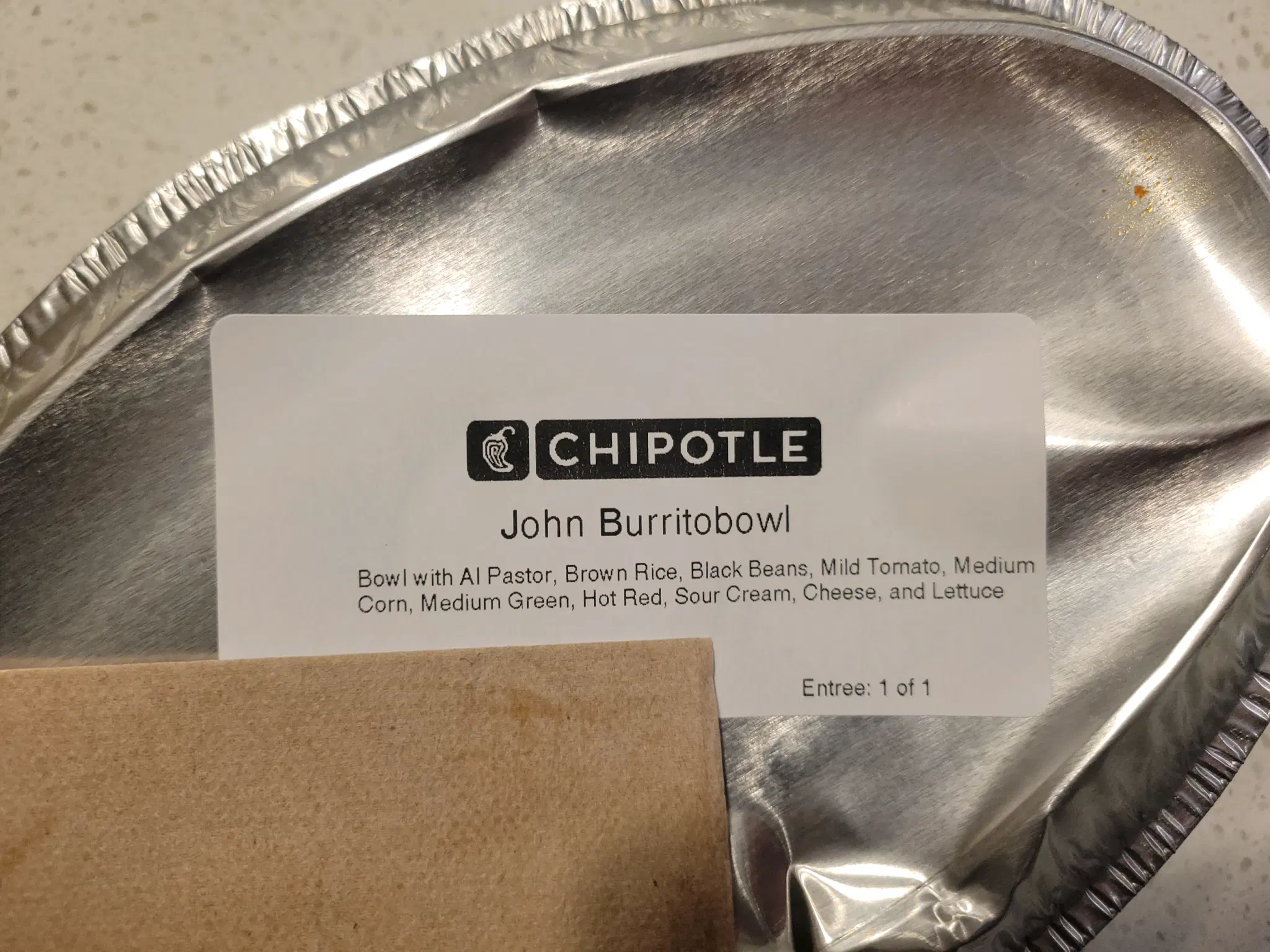 a chipotle bowl with the name john burritobowl